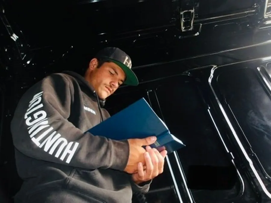 Kolby reading a Bible